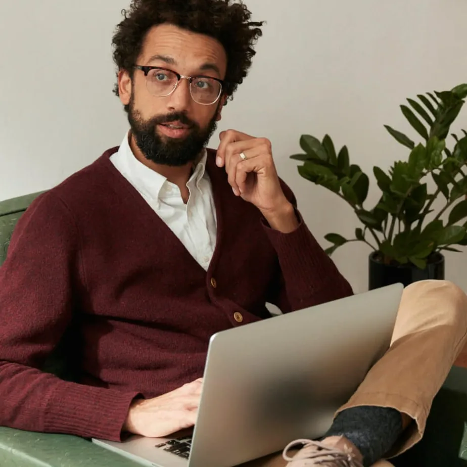 A male employee working from home on his laptop